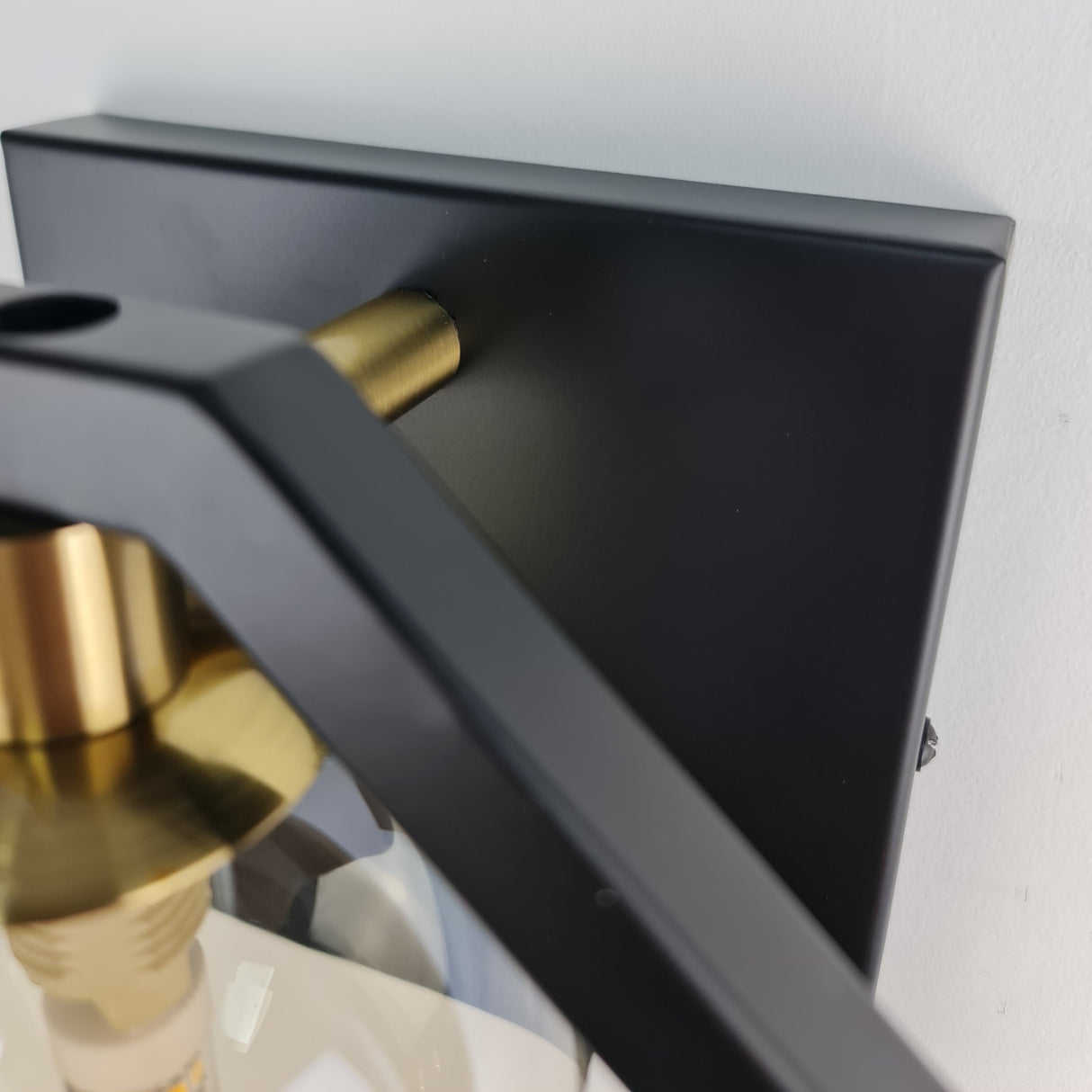 Marlow black gold wall light in hallway — GildNest UK