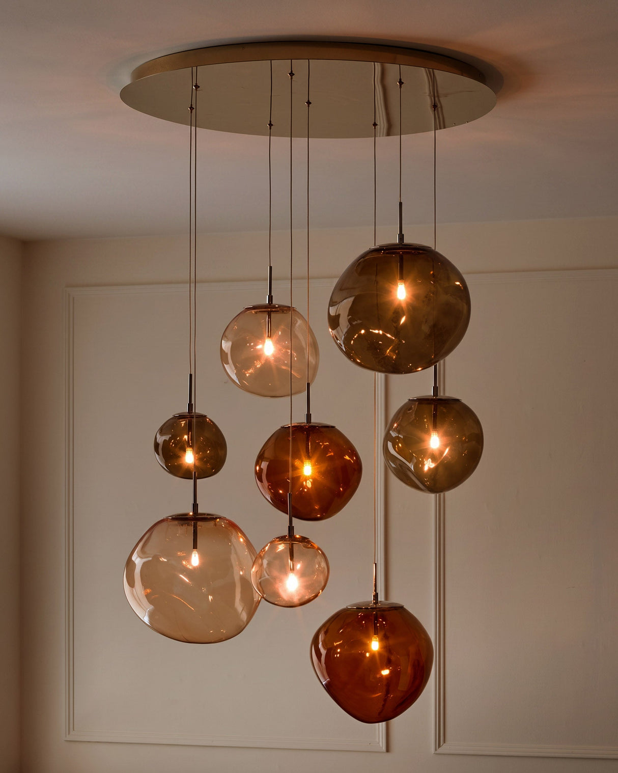 Orla 8-Bulb Mocha Caramel Glass Pendant Light lit