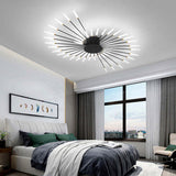 Wesley fireworks flush mount ceiling light installed and lit above a bed, Black finish
