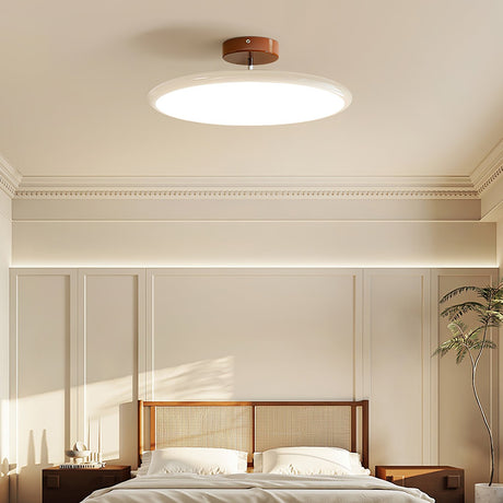 Fyne adjustable ceiling light installed in a bedroom, lit above a bed