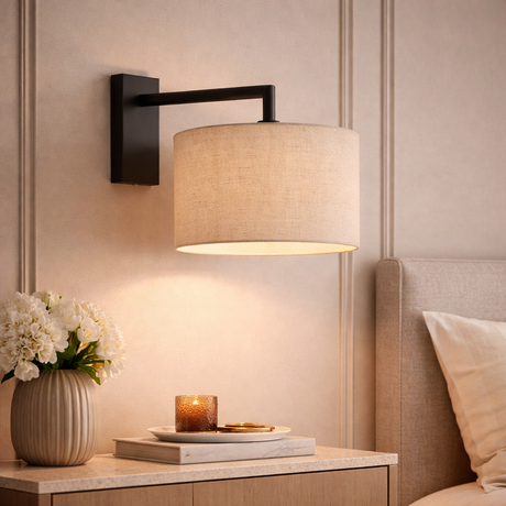 Fairview matt black wall light with natural linen shade in bedroom — GildNest UK